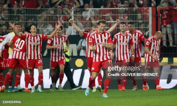Union Berlin's team celebrates after Union Berlin's Dutch defender Danilho Doekhi scored the 2:1 goal during the German first division Bundesliga...