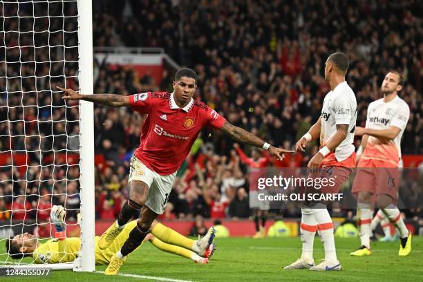 Manchester United's English striker Marcus Rashford celebrates after scoring the opening goal of the English Premier League football match between...