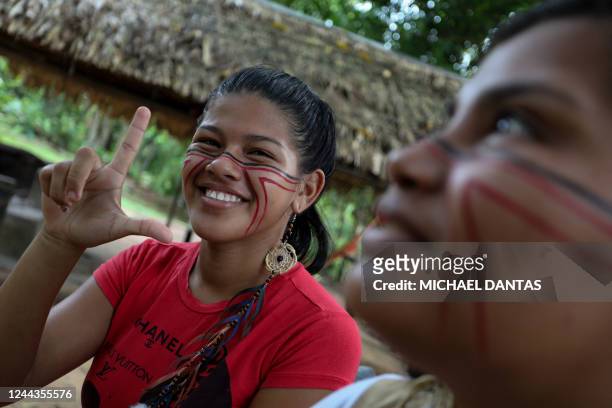 Member of the indigenous ethnic group Sateré-Mawé flashes the "L for Lula" before voting in the community of Sahu-Apé, in Iranduba, Amazonas State,...