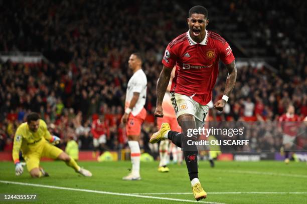 Manchester United's English striker Marcus Rashford celebrates after scoring the opening goal of the English Premier League football match between...