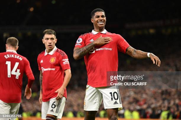 Manchester United's English striker Marcus Rashford celebrates after scoring the opening goal of the English Premier League football match between...