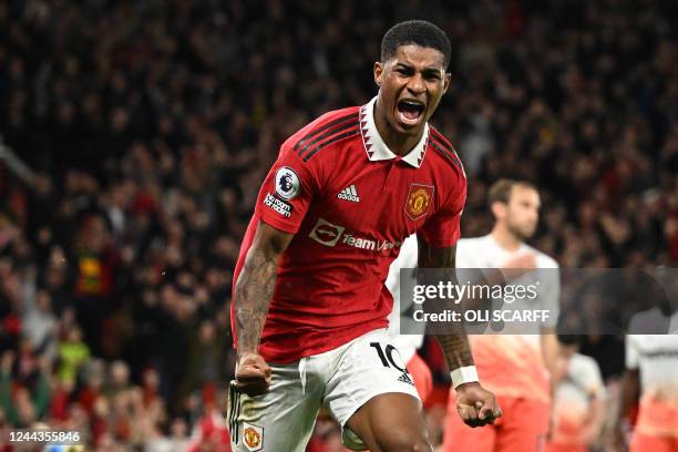 Manchester United's English striker Marcus Rashford celebrates after scoring the opening goal of the English Premier League football match between...