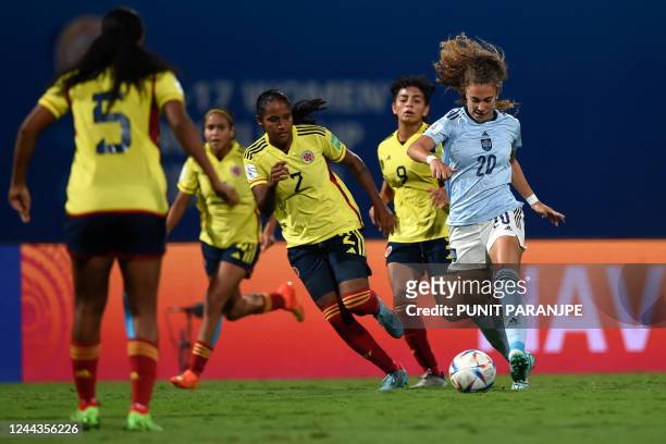 Spain's Paula Partido handles the ball past Colombian players during the FIFA U-17 womens football World Cup 2022 final match between Colombia and...