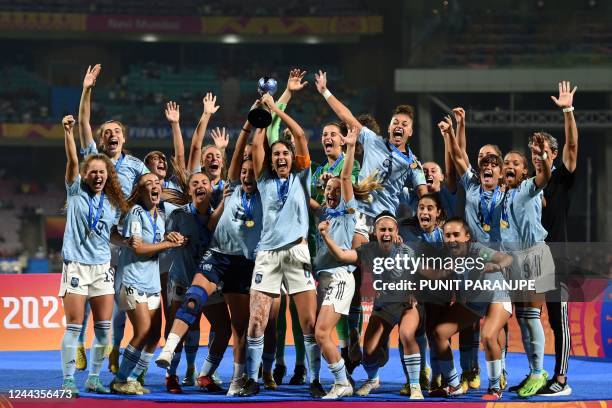 Spain's players celebrate with the trophy after winning the FIFA U-17 womens football World Cup 2022 final match against Colombia at the DY Patil...