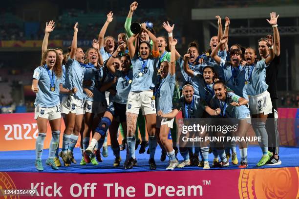 Spain's players celebrate with the trophy after winning the FIFA U-17 womens football World Cup 2022 final match against Colombia at the DY Patil...