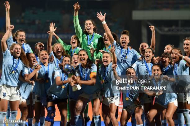 Spain's players celebrate with the trophy after winning the FIFA U-17 womens football World Cup 2022 final match against Colombia at the DY Patil...