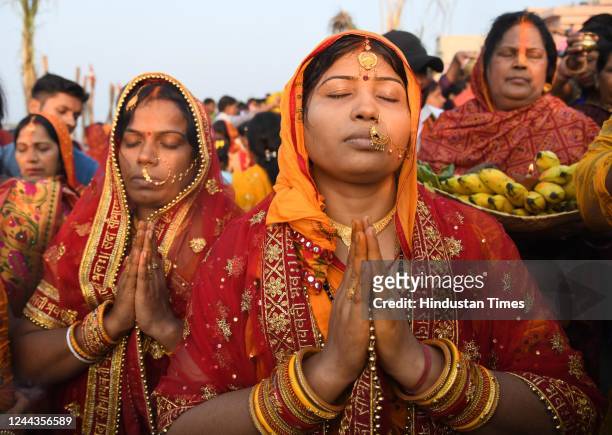 Devotees perform rituals on the occasion of Chhath Pooja festival at Danapur Ghat, on October 30, 2022 in Patna, India. Thousands of devotees...