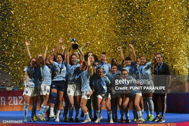 Spain's players celebrate with the trophy after winning the FIFA U-17 womens football World Cup 2022 final match against Colombia at the DY Patil...