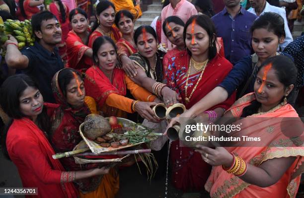 Devotees perform rituals on the occasion of Chhath Pooja festival at Danapur Ghat, on October 30, 2022 in Patna, India. Thousands of devotees...