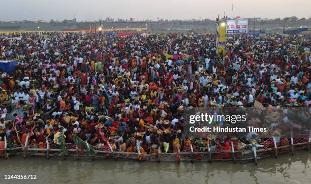 Devotees perform rituals on the occasion of Chhath Pooja festival at Digha Ghat, on October 30, 2022 in Patna, India. Thousands of devotees...