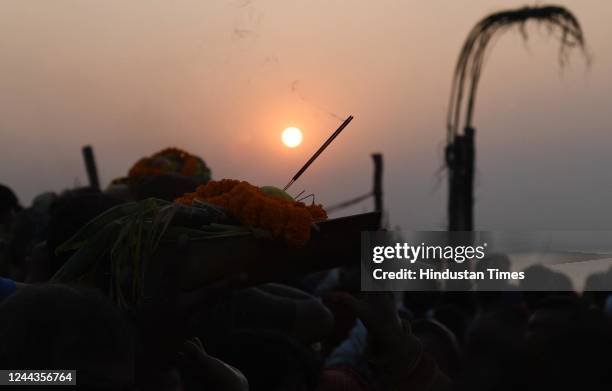 Devotees gather at Danapur Ghat, located on the bank of Ganga river, to perform rituals on the occasion of Chhath Pooja festival, on October 30, 2022...