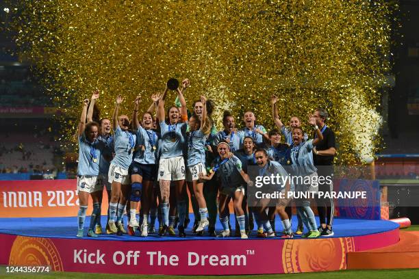 Spain's players celebrate with the trophy after winning the FIFA U-17 women's football World Cup 2022 final match against Colombia at the DY Patil...