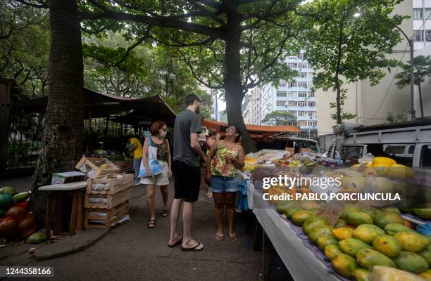 People visit a street market in Copacabana neighbourhood in Rio de Janeiro, Brazil, on October 30 as Brazil holds the presidential run-off election....