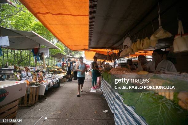 People visit a street market in Copacabana neighbourhood in Rio de Janeiro, Brazil, on October 30 as Brazil holds the presidential run-off election....