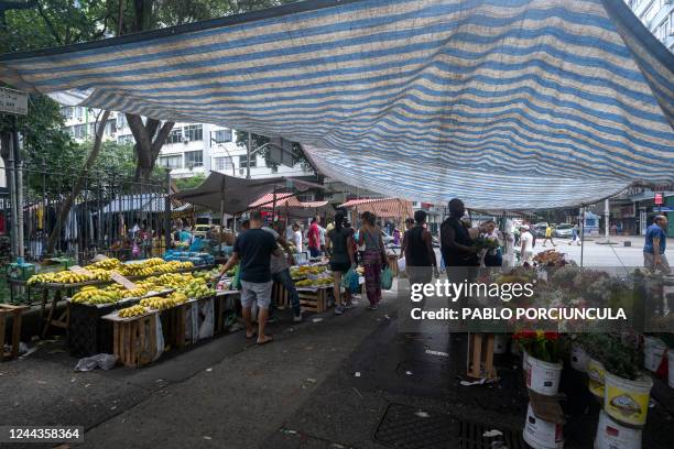 People visit a street market in Copacabana neighbourhood in Rio de Janeiro, Brazil, on October 30 as Brazil holds the presidential run-off election....