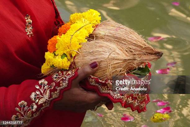 Devotees perform religious rituals as they offer prayers during Chhath Puja festival in Ajmer, Rajasthan, India on October 30, 2022.