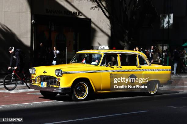 Yellow cab drives the street in New York City, United States on October 22, 2022.