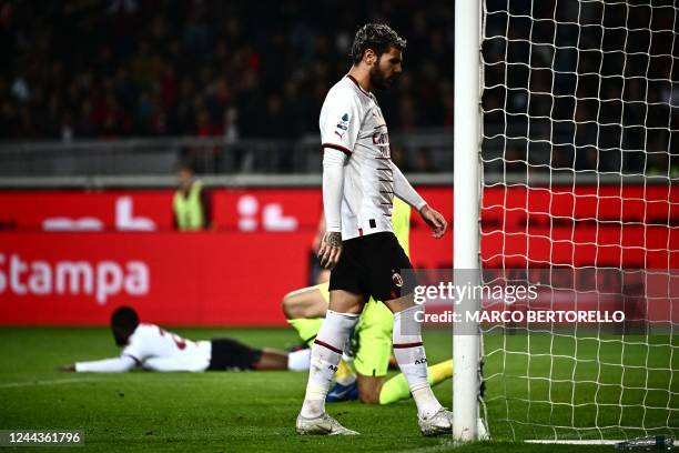 Milans French defender Theo Hernandez reacts during the Italian Serie A football match between Torino and AC Milan at the Grande Torino Stadium in...