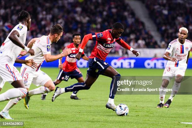 Timothy Weah of Lille runs with the ball during the Ligue 1 match between Olympique Lyonnais and LOSC Lille at Groupama Stadium on October 30, 2022...