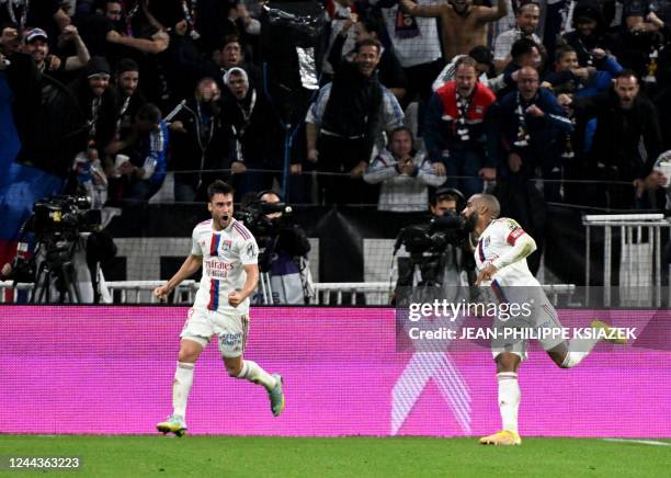 Lyons French forward Alexandre Lacazette celebrates after scoring a goal during the French L1 football match between Olympique Lyonnais and Lille...