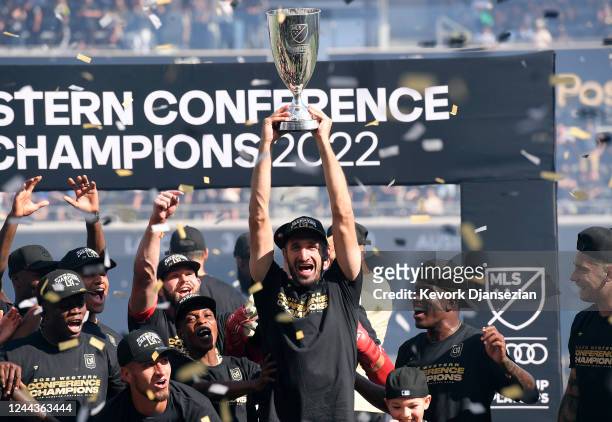 Giorgio Chiellini of Los Angeles FC holds the championship trophy as he celebrates with teammates after defeating Austin FC, 3-0, during the Western...