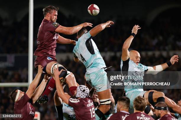 Bordeaux' Autralian lock Kane Douglas , Toulon' French lock Swan Rebbadj and Toulon's Italian number eight Sergio Parisse fight for the ball during...