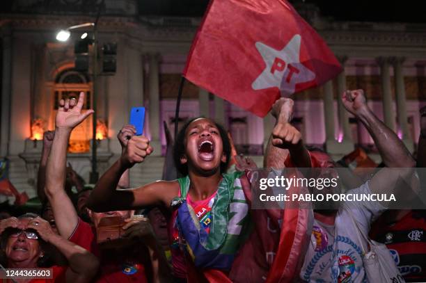 Supporters of Brazilian former President and candidate for the leftist Workers Party Luiz Inacio Lula da Silva celebrate after their candidate won...