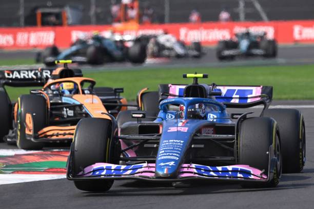 AUTO-PRIX-MEX-F1-RACEAlpine's French driver Esteban Ocon (R) races ahead of McLaren's British driver Lando Norris during the Formula One Mexico Grand Prix at the Hermanos Rodriguez racetrack in Mexico City on October 30, 2022.