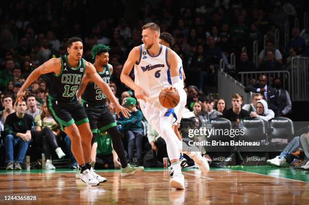 Kristaps Porzingis of the Washington Wizards handles the ball during the game against the Boston Celtics on October 30, 2022 at the TD Garden in...