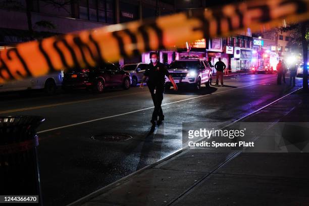Police gather at the scene where two New York City police officers were shot in a confrontation late Wednesday evening in Brooklyn on June 03, 2020...