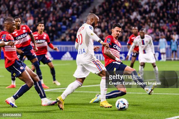 Alexandre Lacazette of Lyon plays against Jose Fonte of Lille during the Ligue 1 match between Olympique Lyonnais and LOSC Lille at Groupama Stadium...