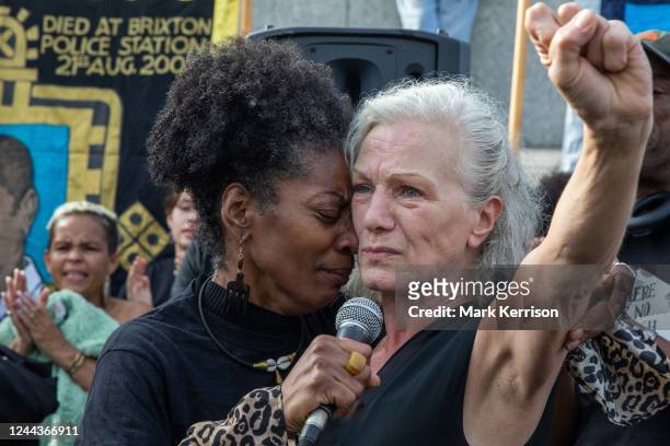 Marcia Rigg , sister of Sean Rigg, embraces Carole Duggan , aunt of Mark Duggan, in Trafalgar Square before the annual procession to Downing Street...