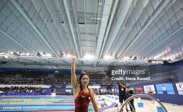 Margaret Mac Neal waves to the crowd after winning the 100 butterfly during finals on day three of the FINA Swimming World Cup at the Pan Am Sports...