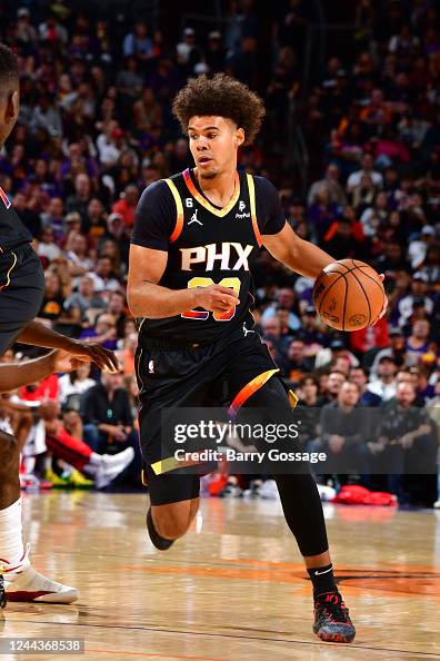 Cam Hodges Rockets Cameron Johnson of the Phoenix Suns handles the ball during the game ...