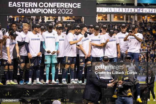 Mark Abbott, President and Deputy Commissioner of Major League Soccer presents the Eastern Conference Championship Trophy to Richard Leibovitch, Vice...