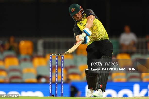 Australia's Aaron Finch plays a shot over the boundary line for six runs during the ICC men's Twenty20 World Cup 2022 cricket match between Australia...