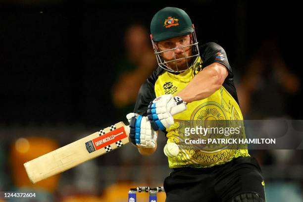 Australia's Captain Aaron Finch plays shot during the ICC men's Twenty20 World Cup 2022 cricket match between Australia and Ireland at The Gabba on...