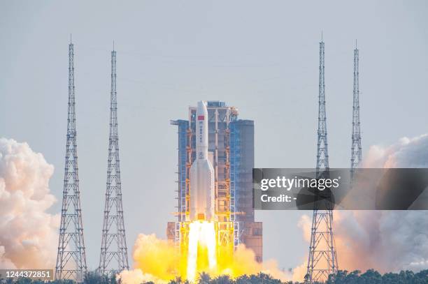 Long March 5B rocket, carrying China's Mengtian science module, the final module of Tiangong space station, lifts off from the Wenchang Space Launch...