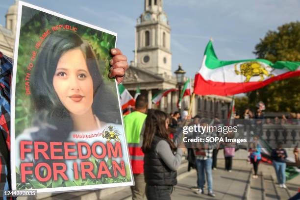 An Iranian protester holds a photograph of Mahsa Amini during the demonstration calling for justice for Mahsa Amini who died in a hospital in Tehran,...