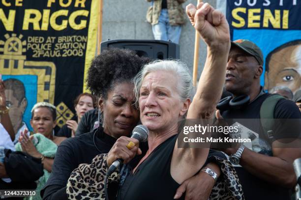 Marcia Rigg , sister of Sean Rigg, embraces Carole Duggan , aunt of Mark Duggan, in Trafalgar Square before the annual United Families & Friends...