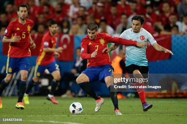 Alvaro Morata of Spain SelCuk Inan of Turkey during the EURO match between Spain v Turkey on June 17, 2016