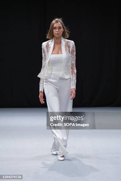 Model walks the runway at the Lily Torres Couture fashion show during the 1001 Bodas Madrid Fashion Week at the Ifema in Madrid.