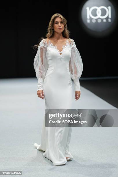 Model walks the runway at the Vertize Gala fashion show during the 1001 Bodas Madrid Fashion Week at the Ifema in Madrid.