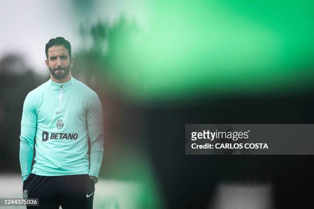 Sporting's Portuguese coach Ruben Amorim watches during a training session in a training session at the Cristiano Ronaldo academy training ground in...
