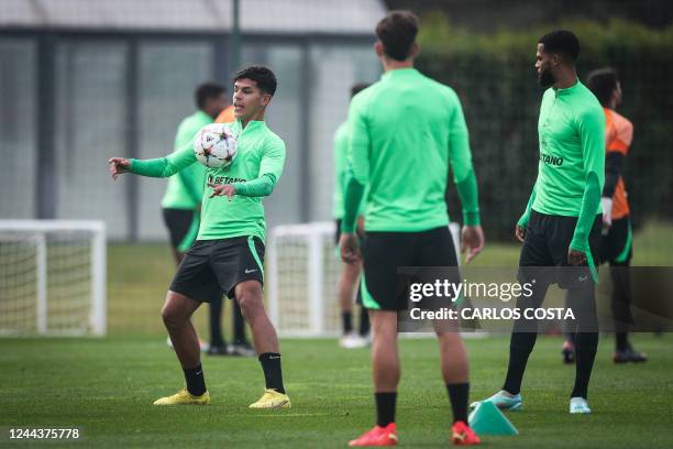 Sporting's Portuguese midfielder Mateus Fernandes and teammates take part in a training session at the Cristiano Ronaldo academy training ground in...