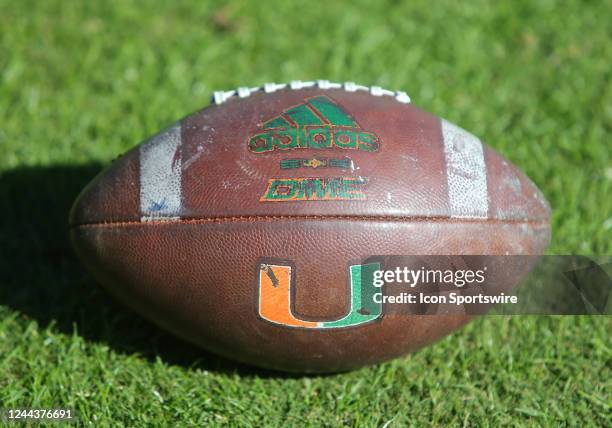 Miami Hurricanes football with logo resting on the field during a college football game between the Miami Hurricanes and the Virginia Cavaliers on...