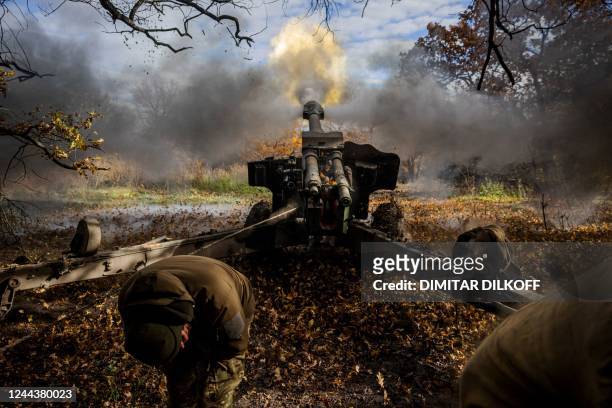 Ukrainian artillerymen fire a 152 mm towed gun-howitzer at a position on the front line near the town of Bakhmut, in eastern Ukraine's Donetsk...