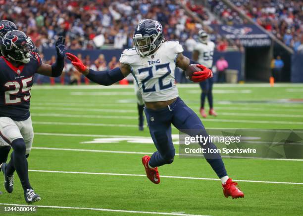 Tennessee Titans running back Derrick Henry stiff arms Houston Texans cornerback Desmond King II in the second quarter during the NFL game between...