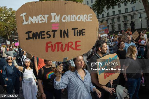 Hundreds of parents and young children, some of whom dressed in Halloween costume, take part in the March of the Mummies to demand rights for working...