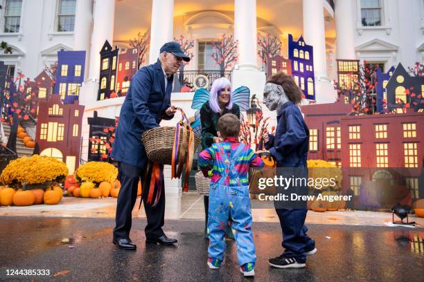 President Joe Biden and first lady Jill Biden greet trick-or-treaters during a Halloween event on the South Lawn of the White House October 31, 2022...